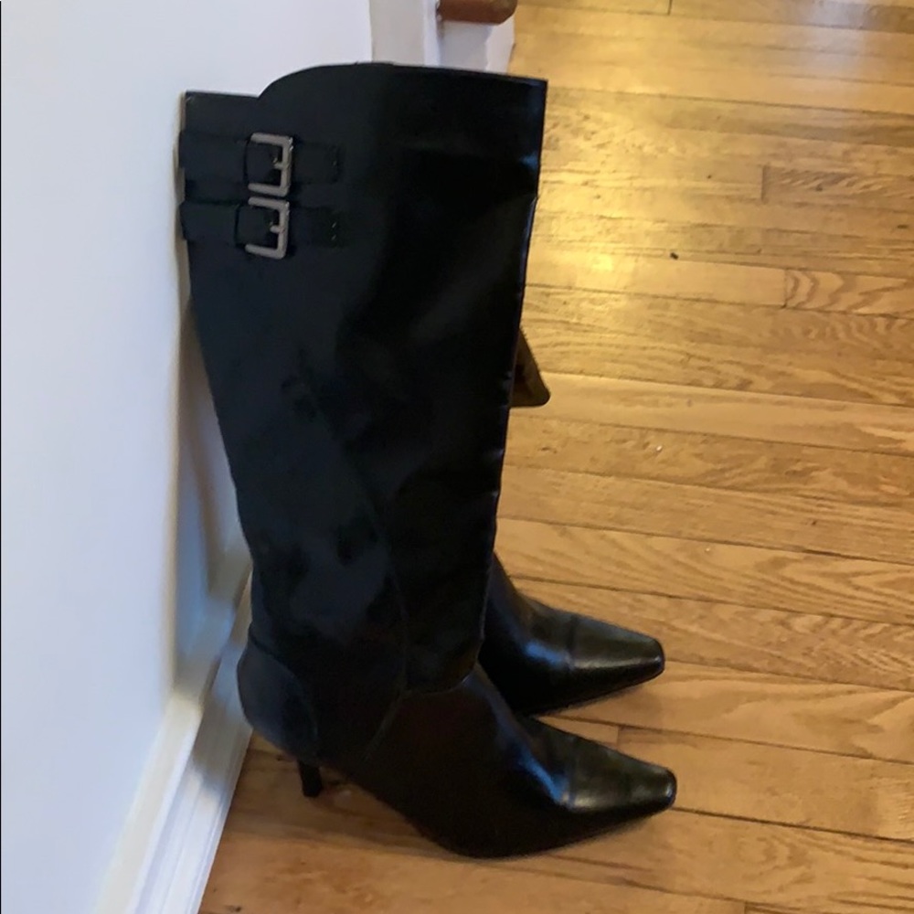 Tall black boots with stiletto heel